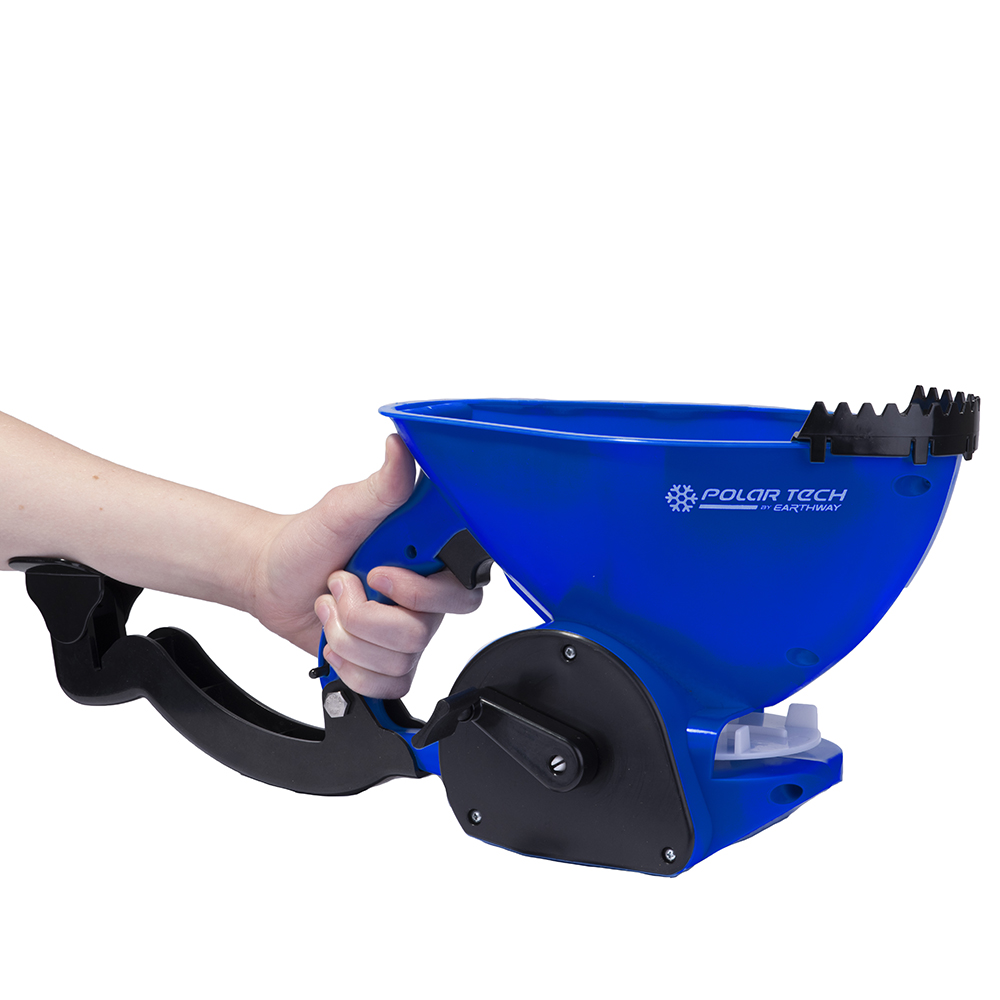 Hand held salt spreader with armrest